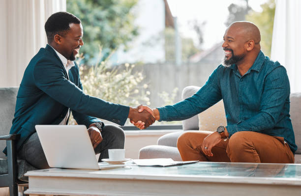 Mirai Global team member shaking hands with a client in Nigeria